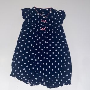 Navy blue polka dotted romper with pink bows. Size 3-6m.